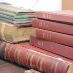 stack of very old books